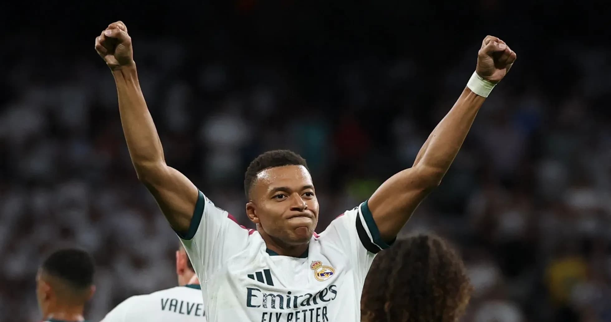 Player celebrating victory with raised arms Player celebrating victory with raised arms