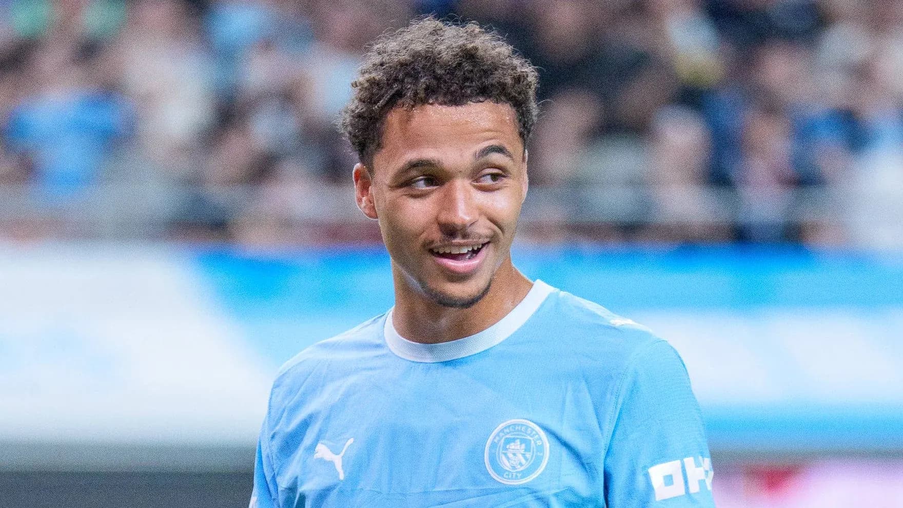 Player smiling during Manchester City warm-up session Player smiling during Manchester City warm-up session