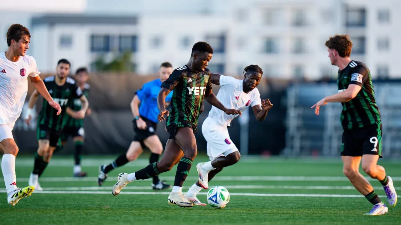 Players competing for the ball in MLS Next Pro match Players competing for the ball in MLS Next Pro match