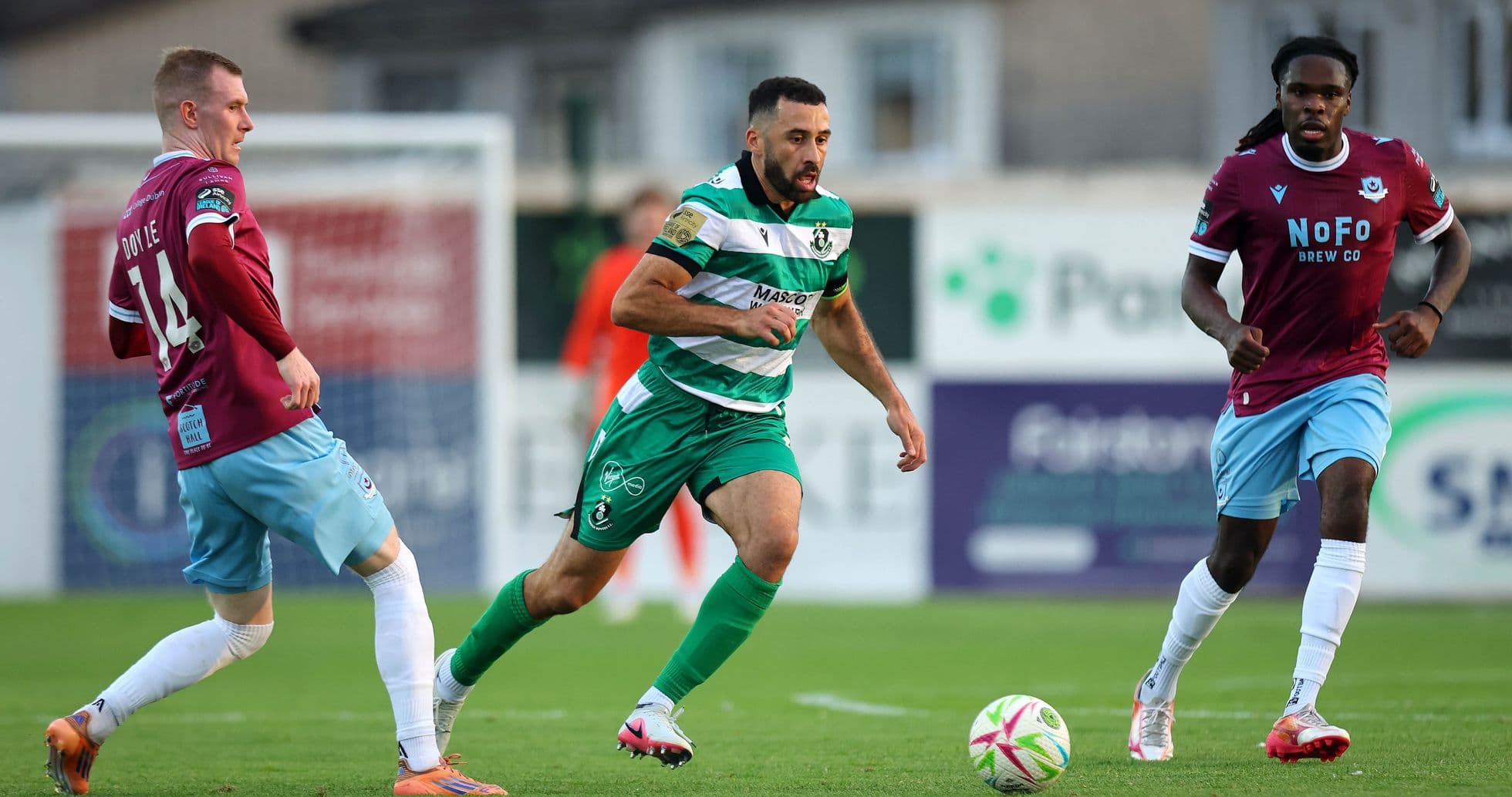 Shamrock Rovers player dribbling past opponent Shamrock Rovers player dribbling past opponent