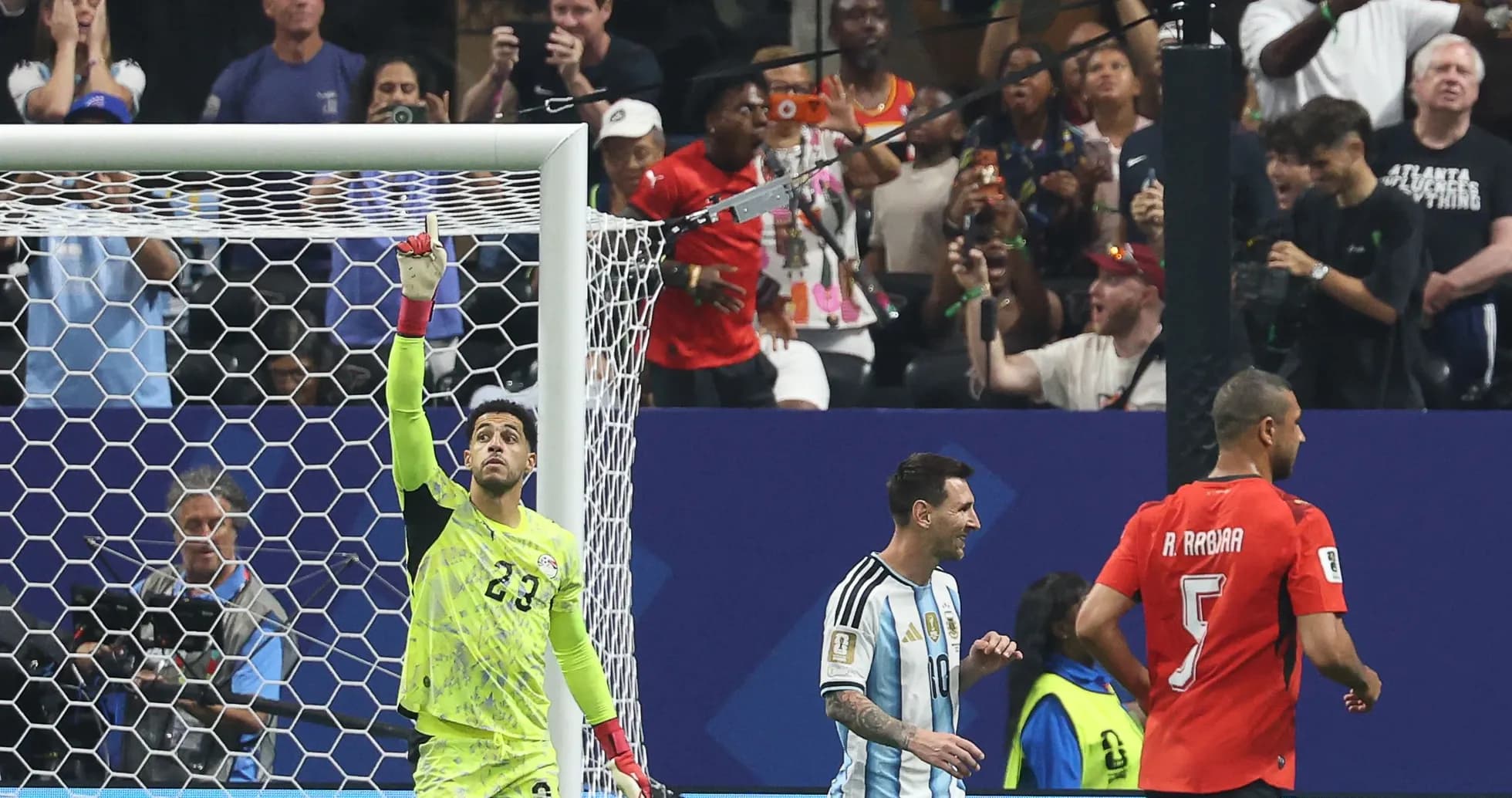 Goalkeeper celebrating with players after a save Goalkeeper celebrating with players after a save