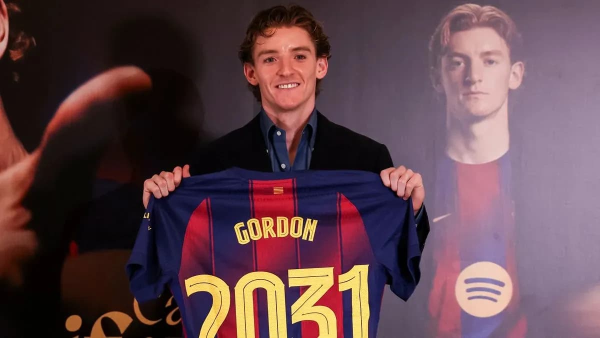 Player holding FC Barcelona jersey with 'GORDON' and '2031' Player holding FC Barcelona jersey with 'GORDON' and '2031'