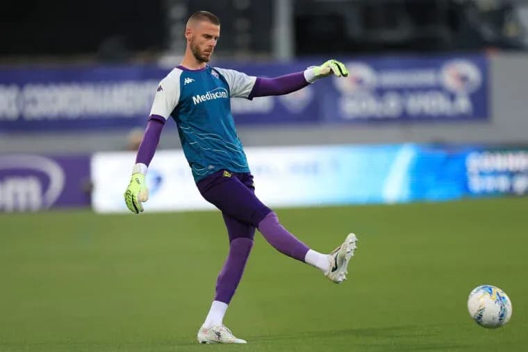 Goalkeeper performing a kick during warm-up session Goalkeeper performing a kick during warm-up session