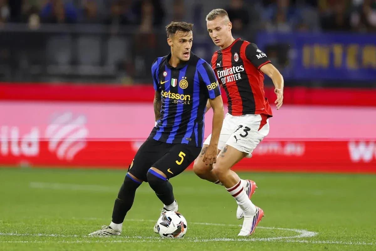 Two players contesting for the ball during match Two players contesting for the ball during match