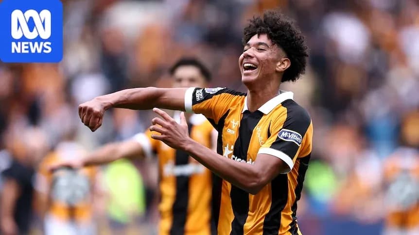 Player celebrating a goal with teammates in stadium Player celebrating a goal with teammates in stadium
