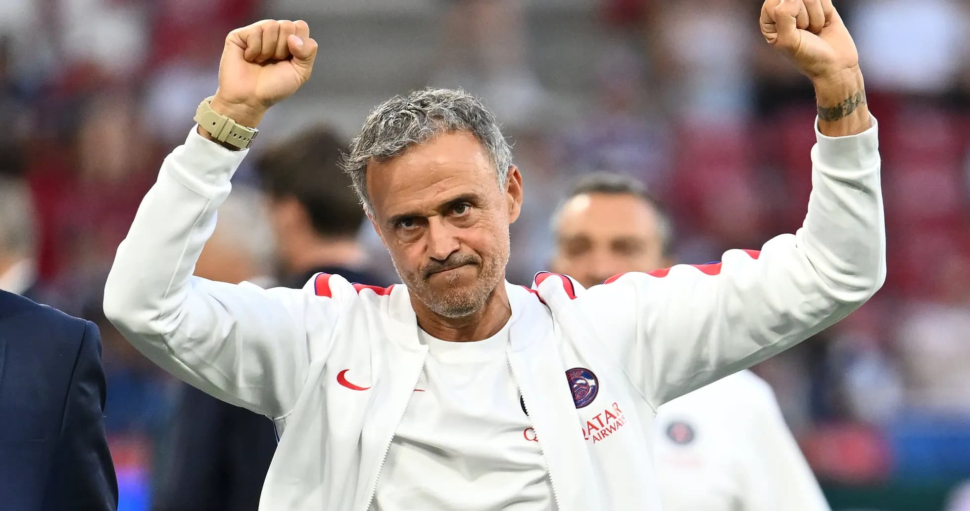 Coach celebrating with raised fists after match Coach celebrating with raised fists after match