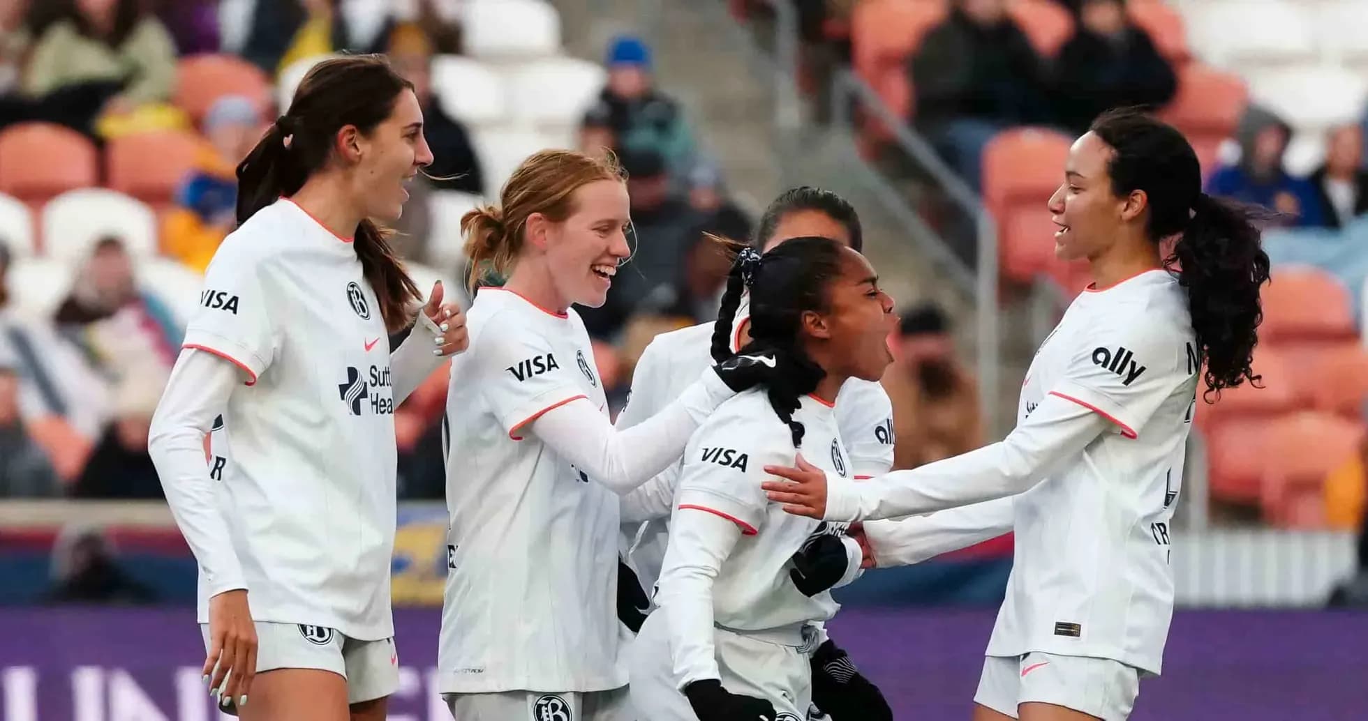 Players celebrating a goal during match Players celebrating a goal during match