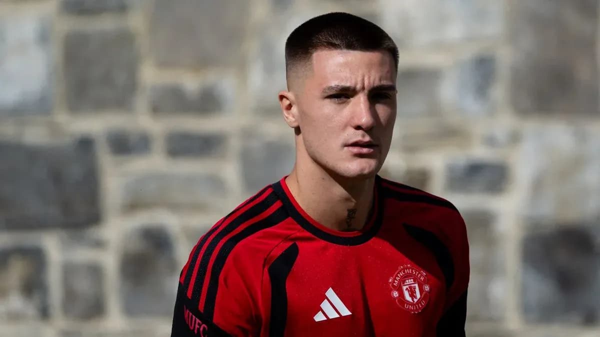 Player in red Manchester United training kit outdoors Player in red Manchester United training kit outdoors