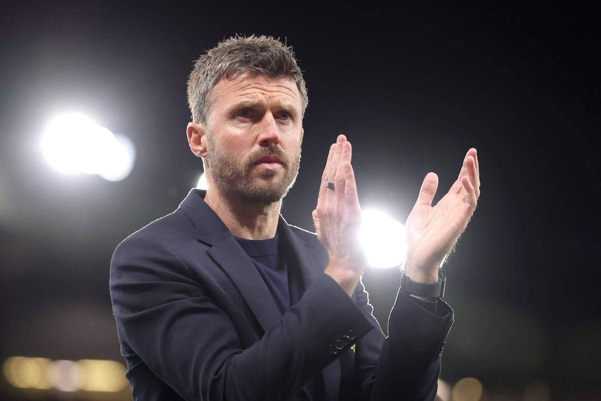 Coach applauding during a match at night Coach applauding during a match at night