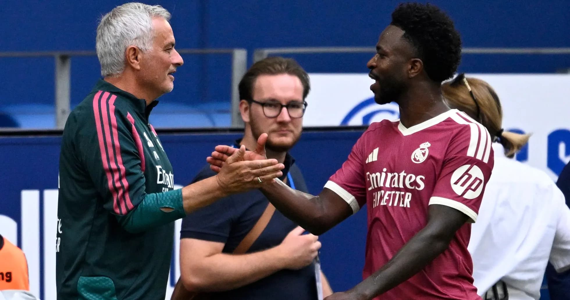 Manager and player shaking hands during match Manager and player shaking hands during match