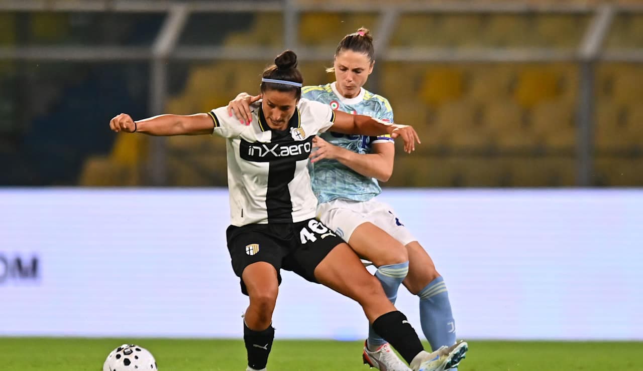 Parma W player challenged by Juventus W opponent Parma W player challenged by Juventus W opponent