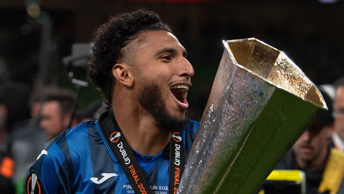Player celebrating with trophy after final match Player celebrating with trophy after final match