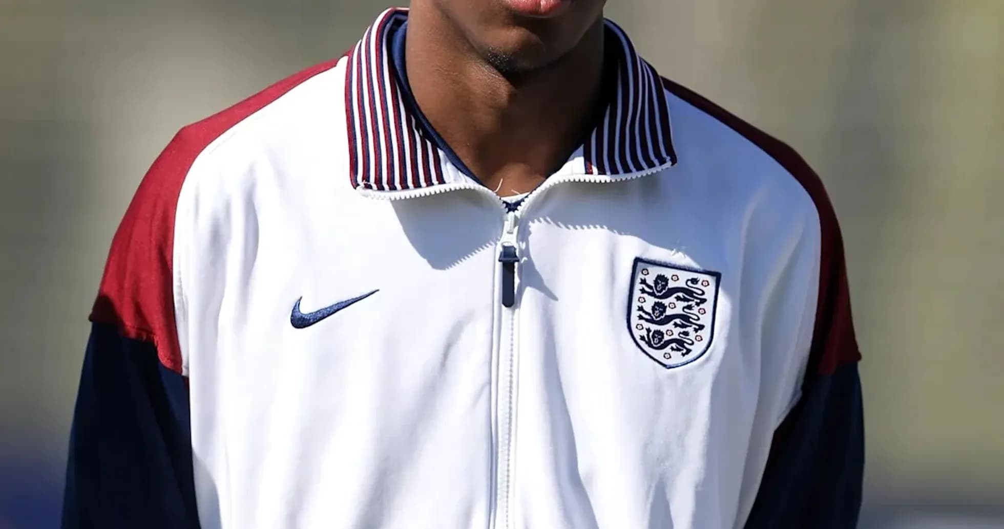 Player wearing England training jacket on pitch Player wearing England training jacket on pitch