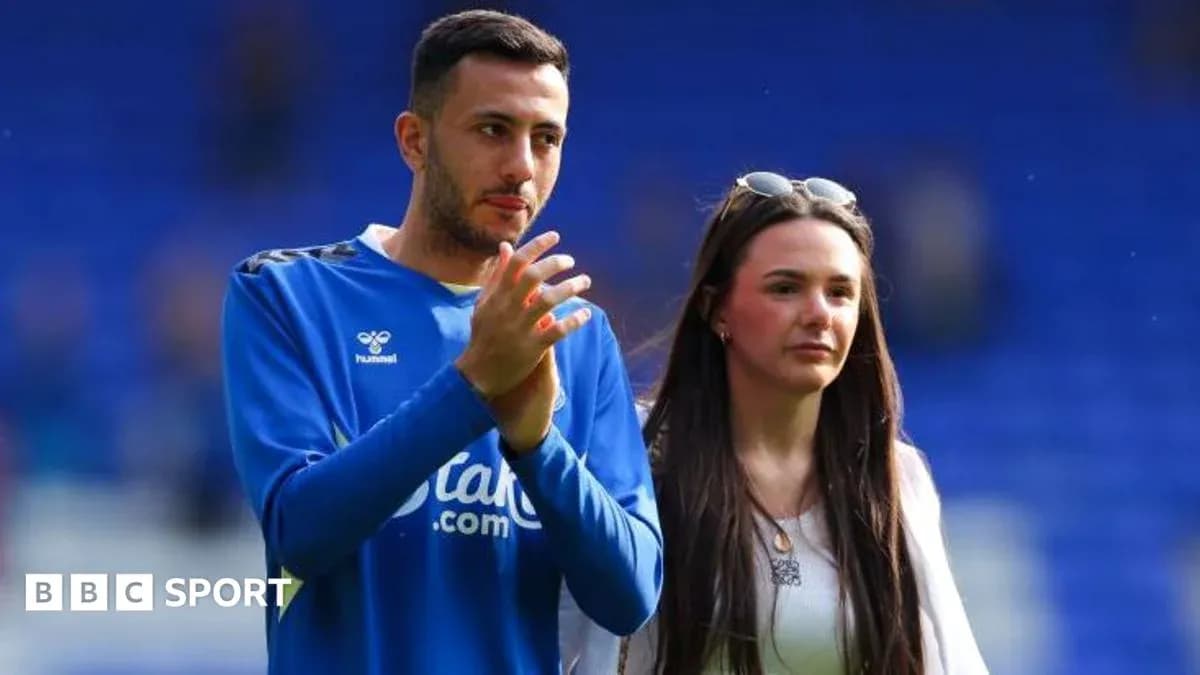 Player applauding with a companion on the field Player applauding with a companion on the field