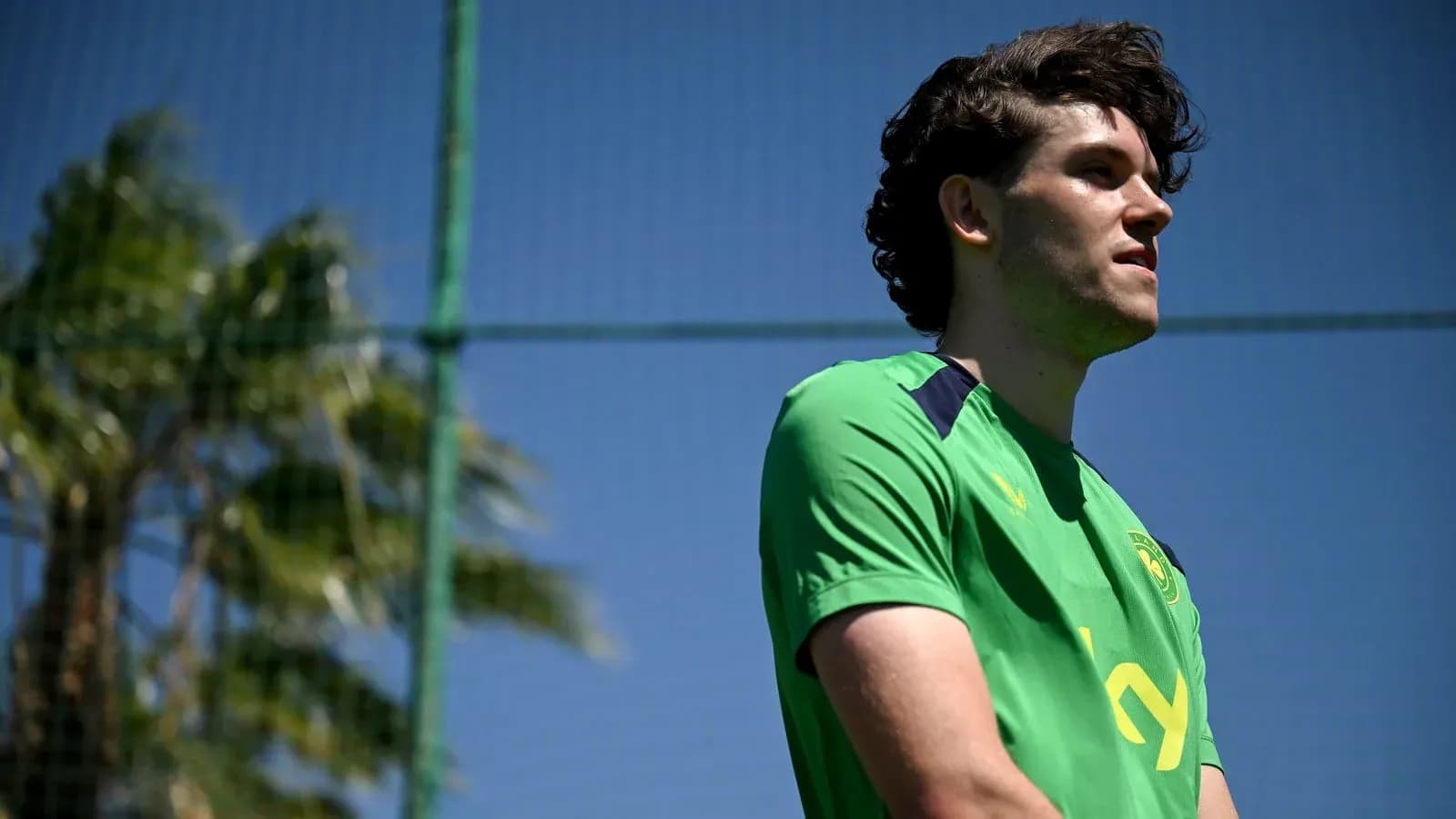 Player in green kit during training session Player in green kit during training session