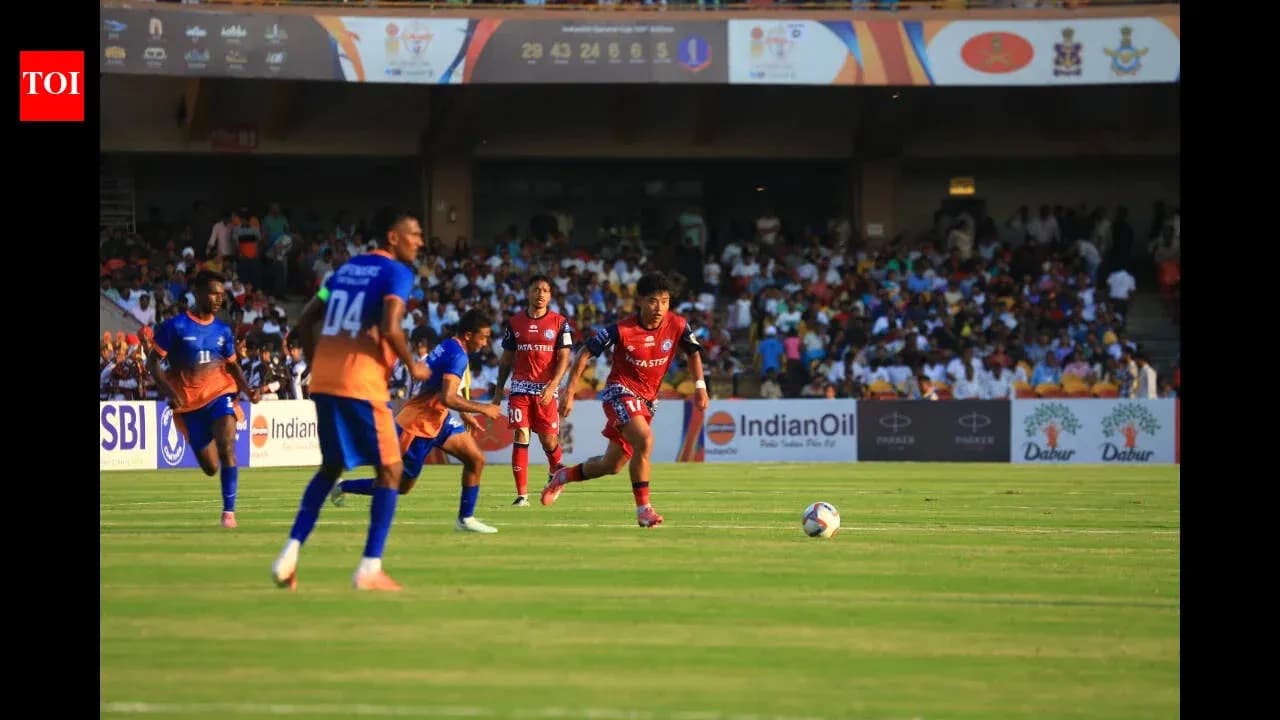 Players in action during a football match Players in action during a football match