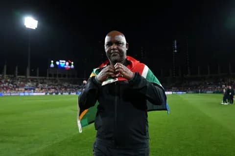 Coach wearing South African flag on the field Coach wearing South African flag on the field