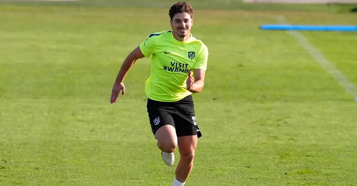 Player running during Atletico Madrid training session Player running during Atletico Madrid training session