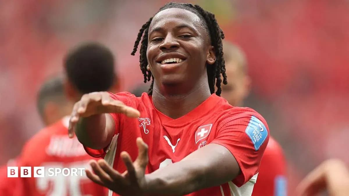 Player celebrating during match in red jersey Player celebrating during match in red jersey