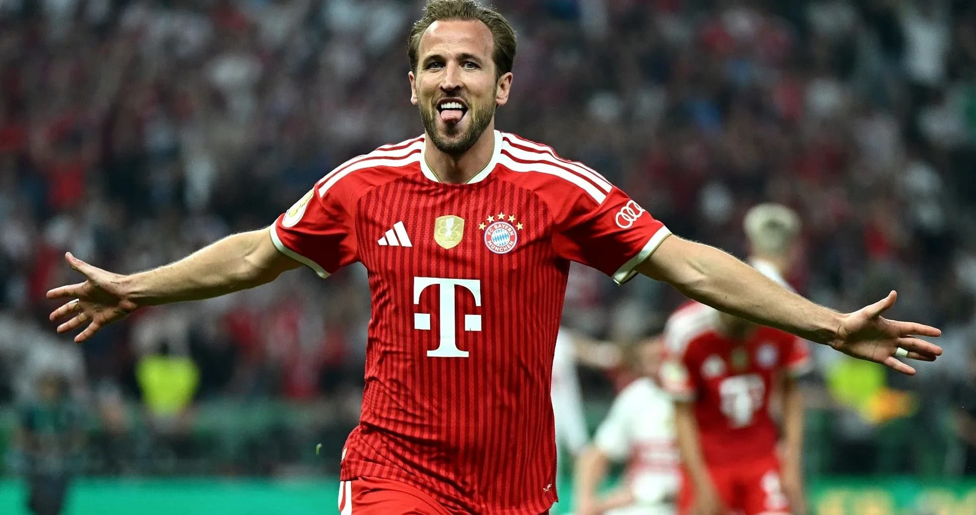 Player celebrating goal wearing Bayern Munich jersey Player celebrating goal wearing Bayern Munich jersey
