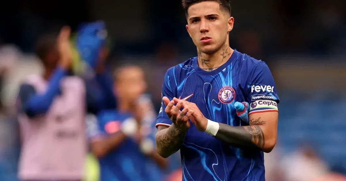 Player applauding fans wearing Chelsea jersey Player applauding fans wearing Chelsea jersey