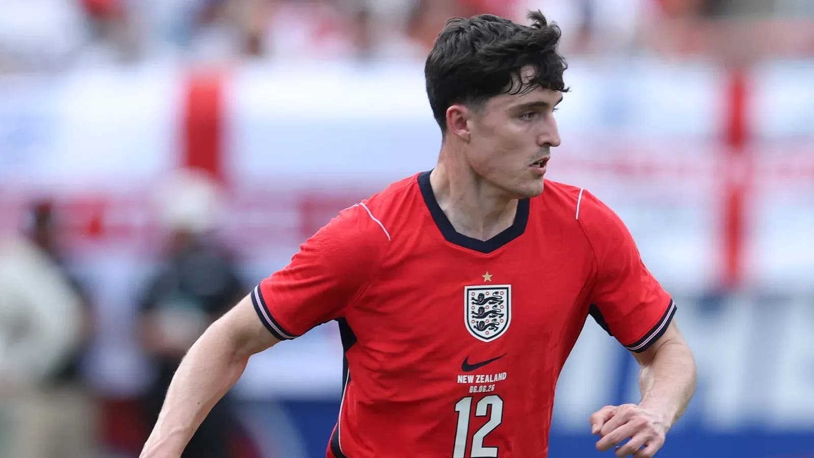 Player in red England jersey during match action Player in red England jersey during match action
