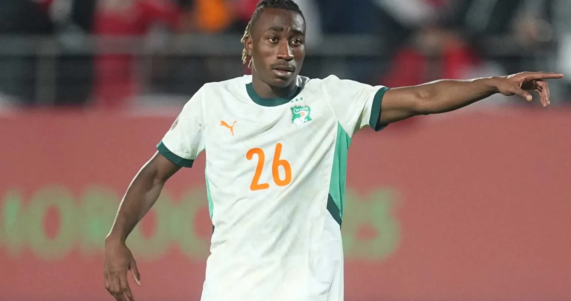 Player wearing Ivory Coast jersey gestures during match Player wearing Ivory Coast jersey gestures during match