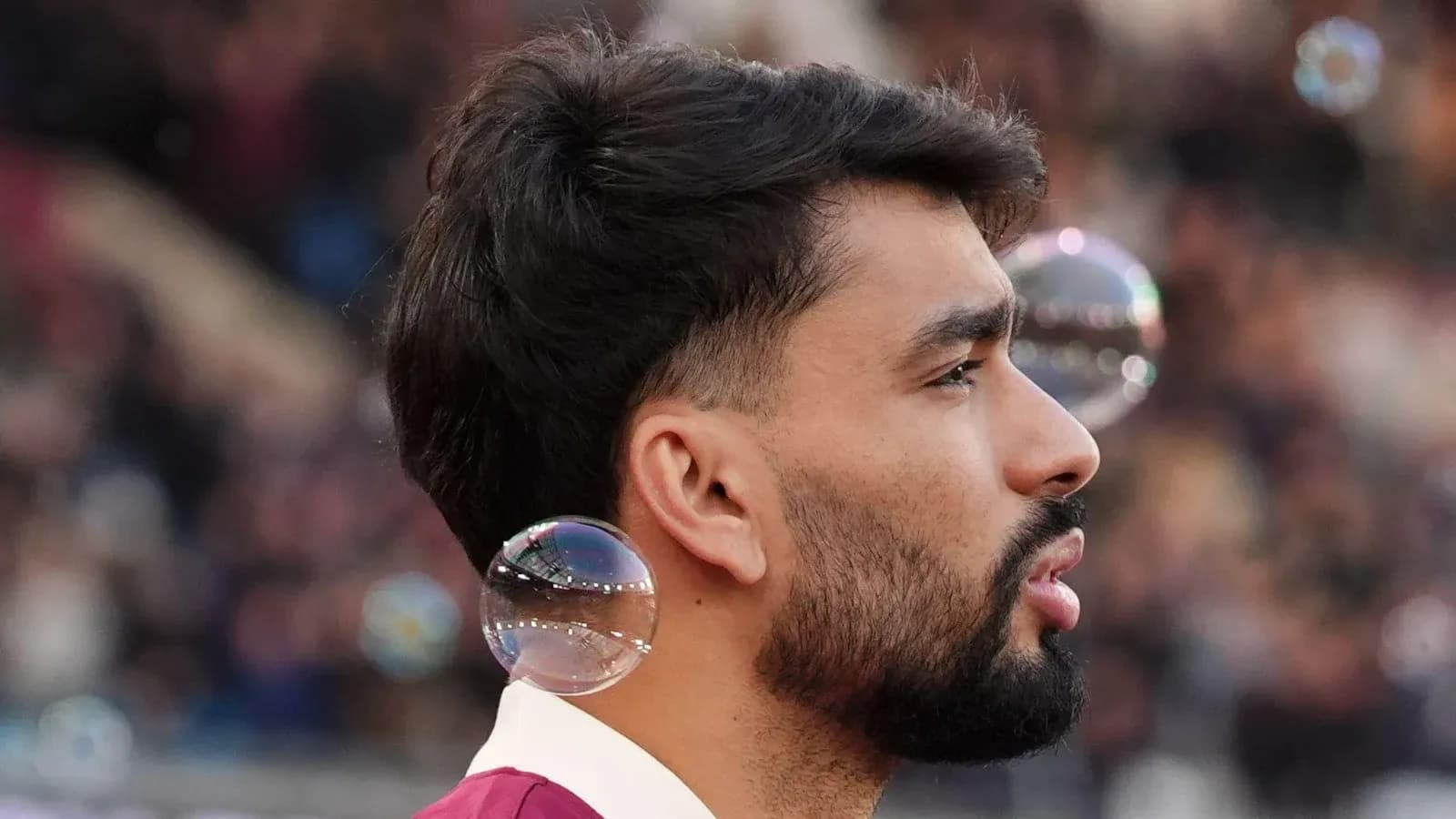 Player with bubbles in background during match Player with bubbles in background during match