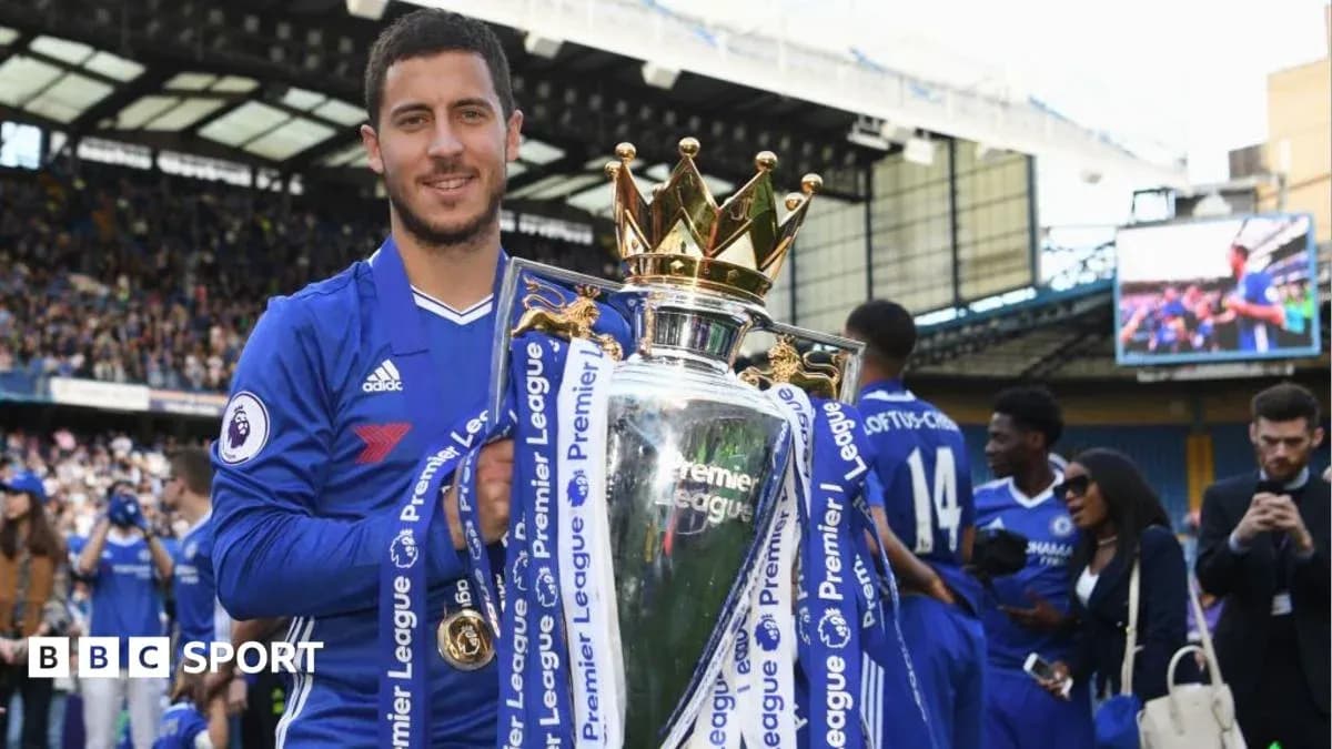 Player holding Premier League trophy in celebration Player holding Premier League trophy in celebration