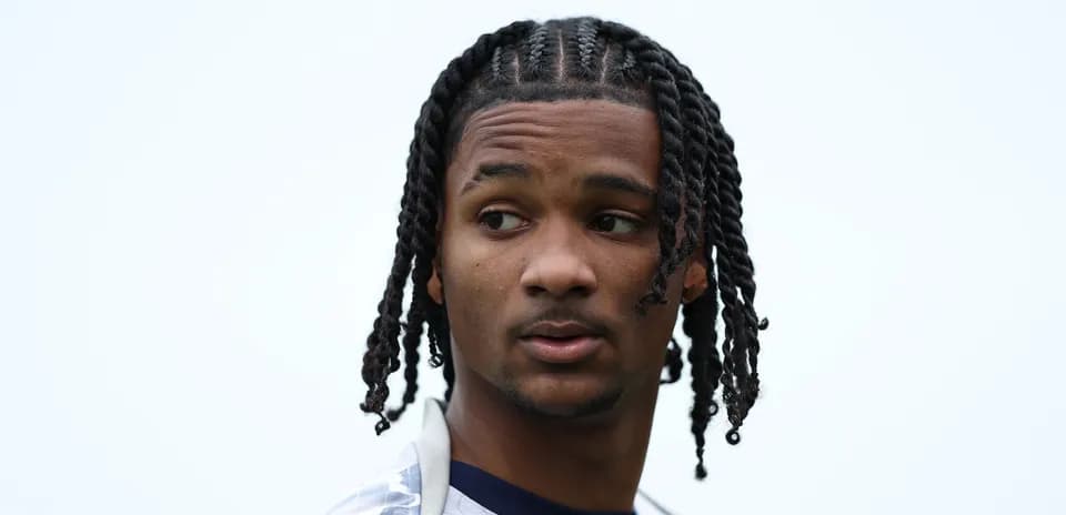 Player with braided hair looking to the side Player with braided hair looking to the side