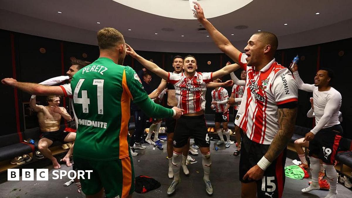 Players celebrating in locker room after match Players celebrating in locker room after match