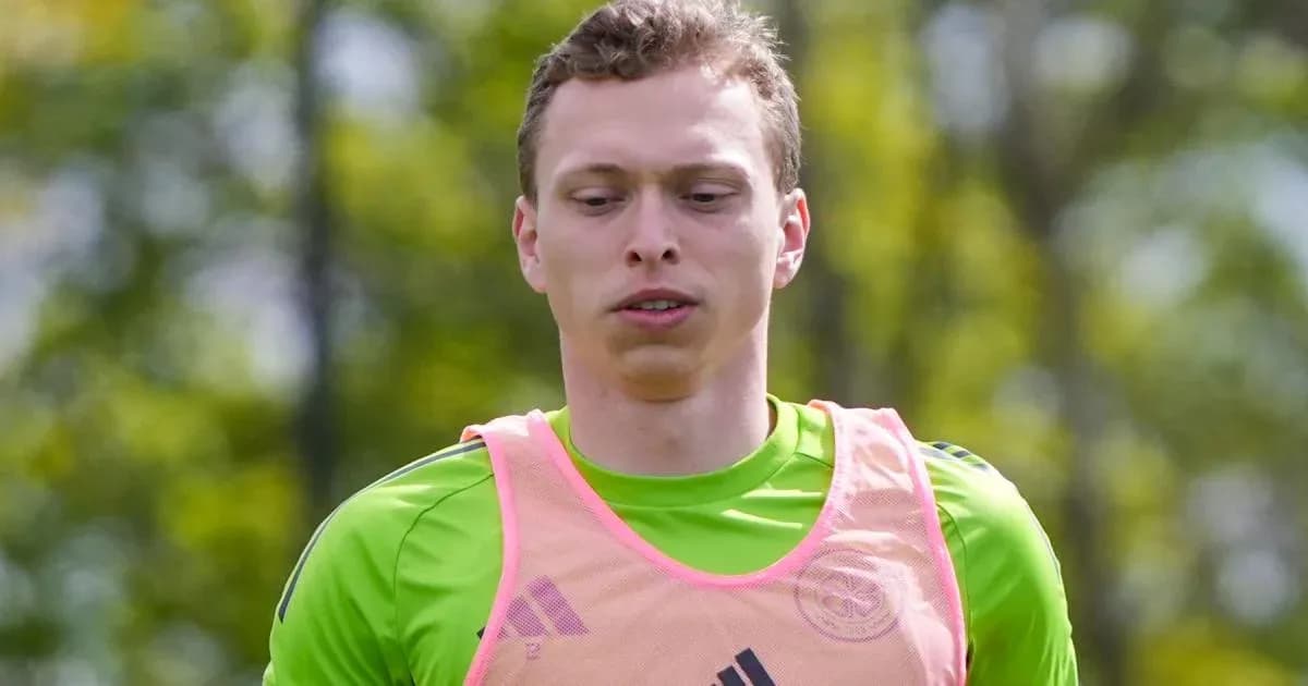 Goalkeeper training in green kit and pink vest Goalkeeper training in green kit and pink vest