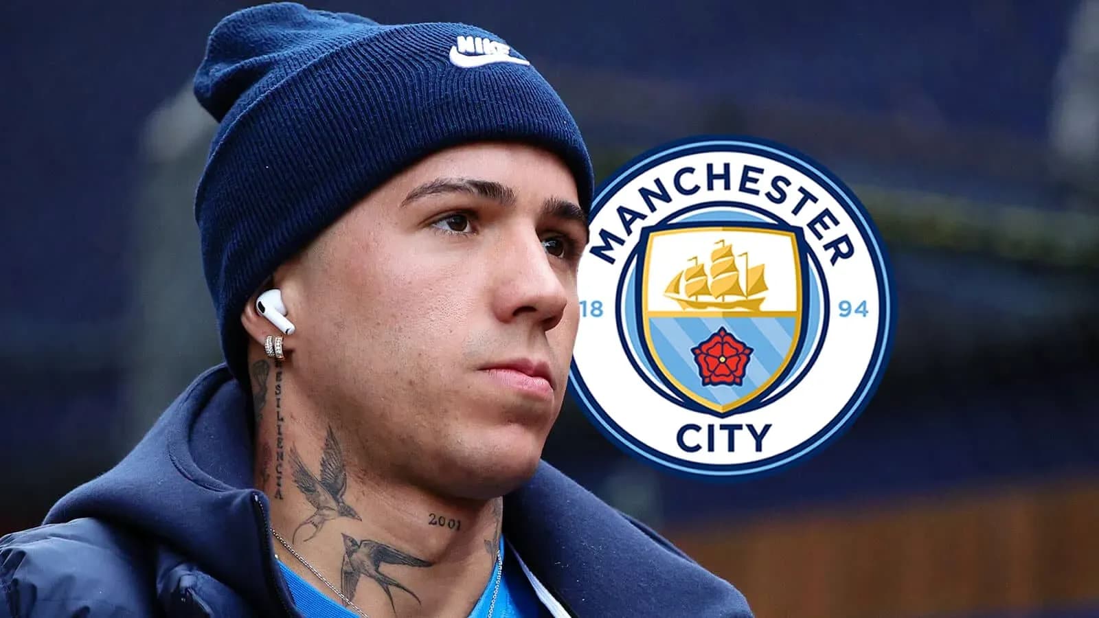 Player with headphones near Manchester City logo Player with headphones near Manchester City logo