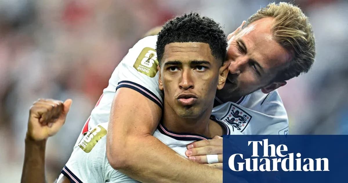 Two England players celebrating during a match Two England players celebrating during a match