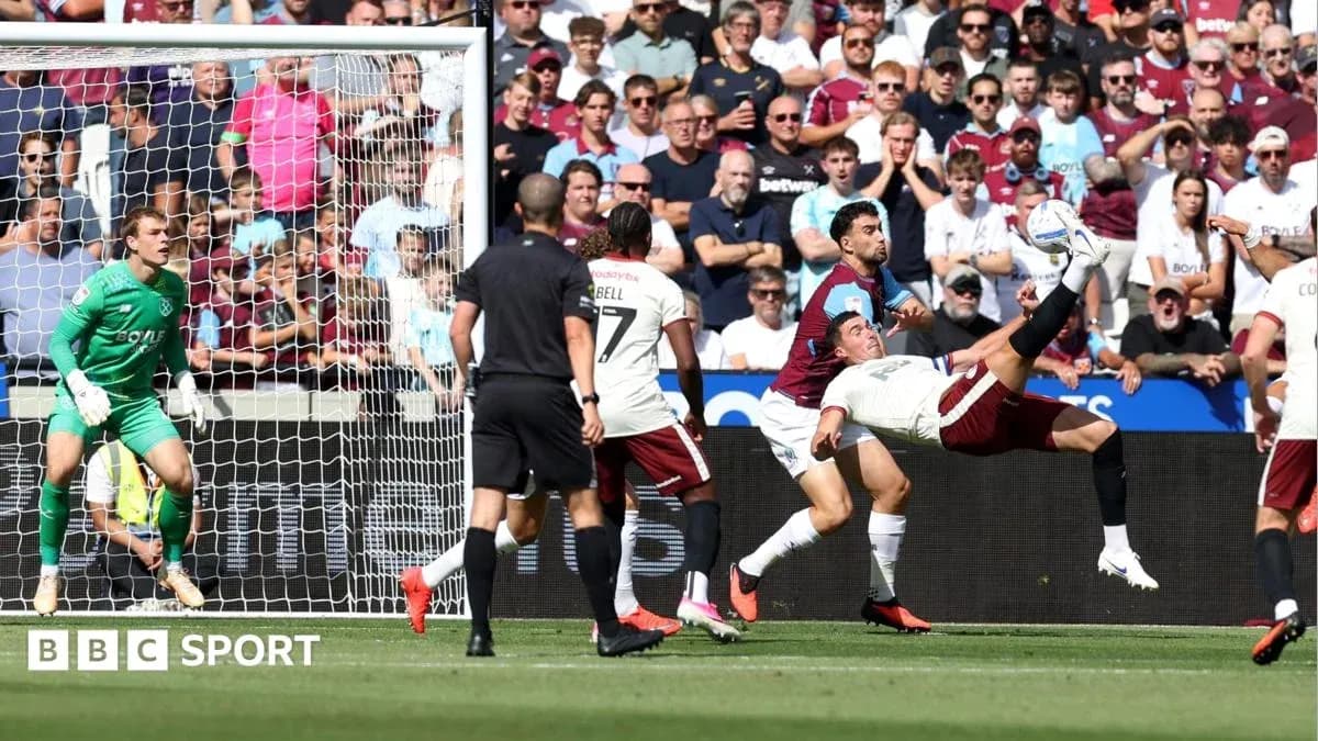 Player performing bicycle kick near goal during match Player performing bicycle kick near goal during match