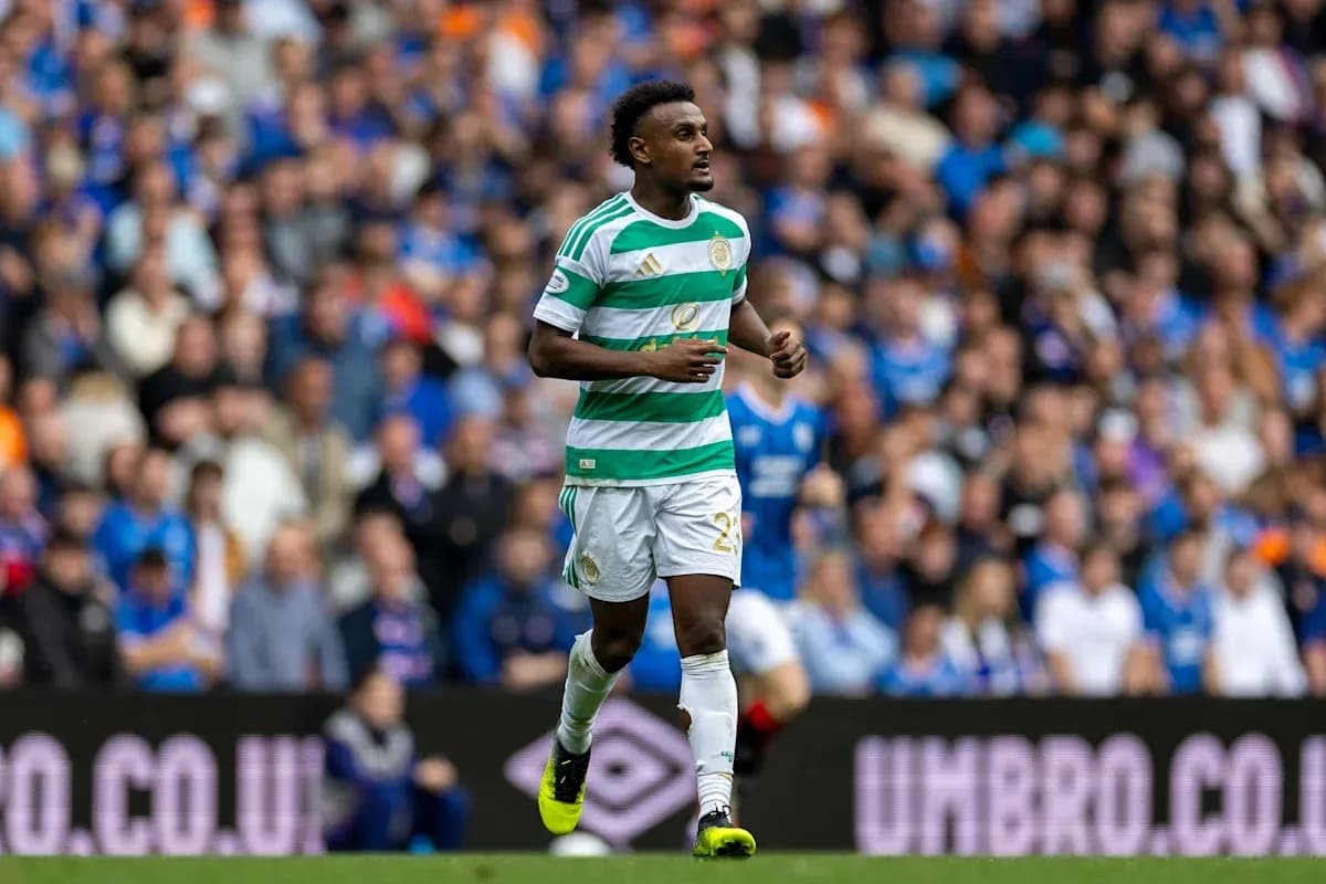 Player in Celtic kit walking on the pitch Player in Celtic kit walking on the pitch