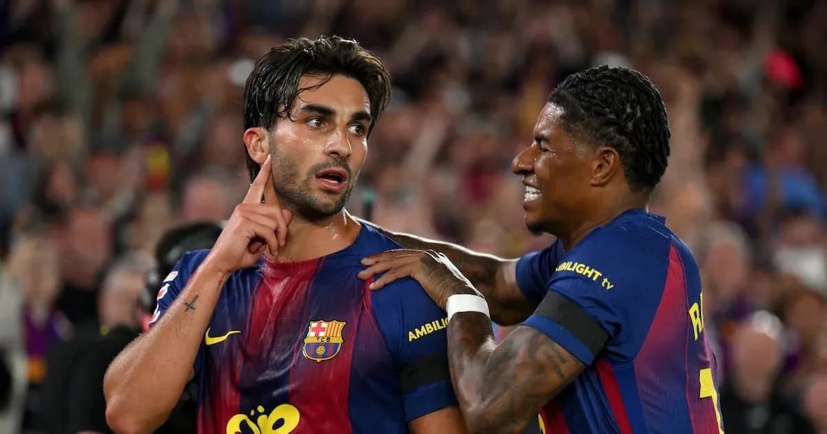 Two FC Barcelona players celebrating on the pitch Two FC Barcelona players celebrating on the pitch