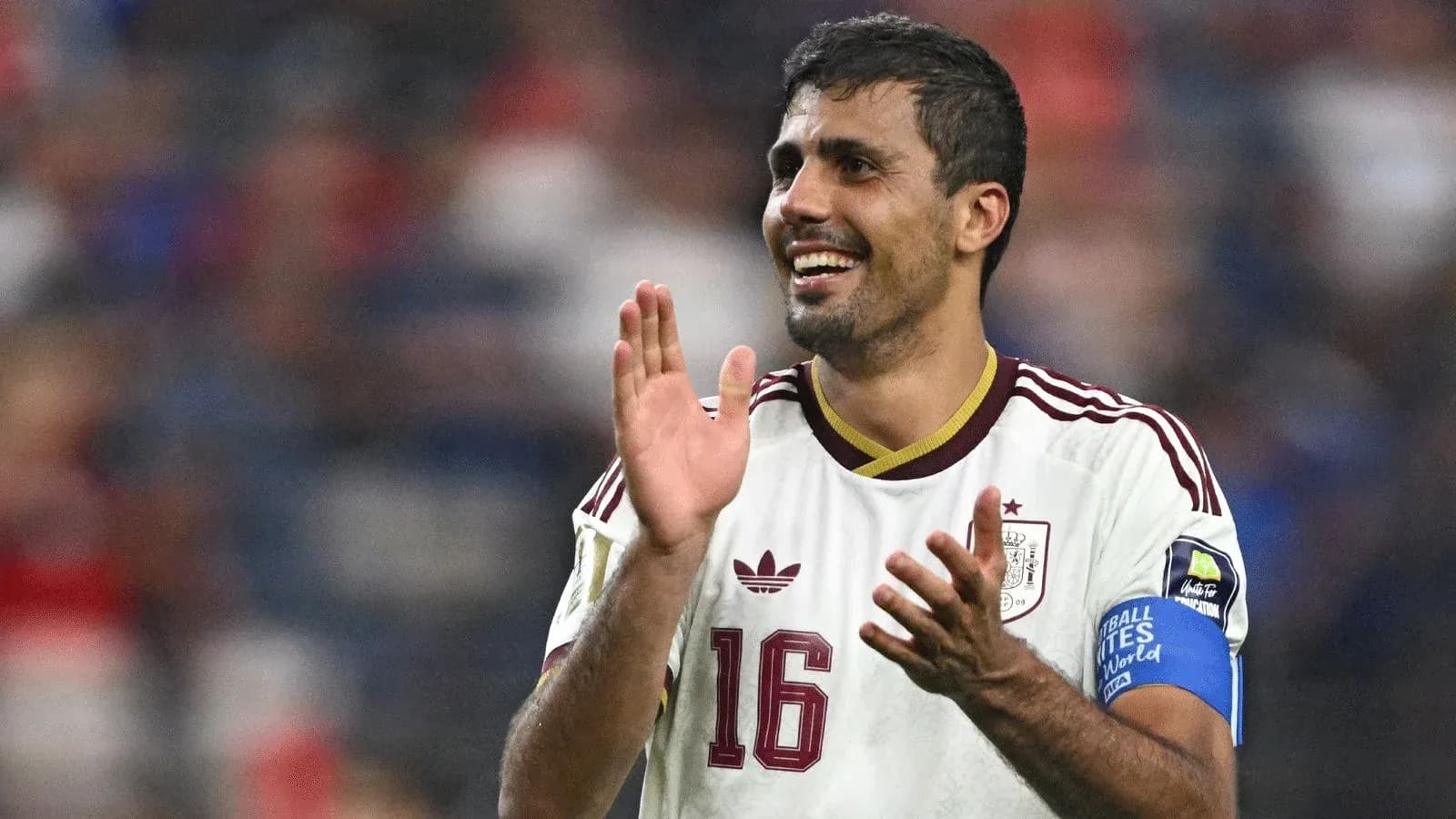 Player celebrating with applause during match Player celebrating with applause during match