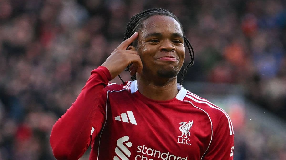 Player celebrating after scoring a goal for Liverpool Player celebrating after scoring a goal for Liverpool