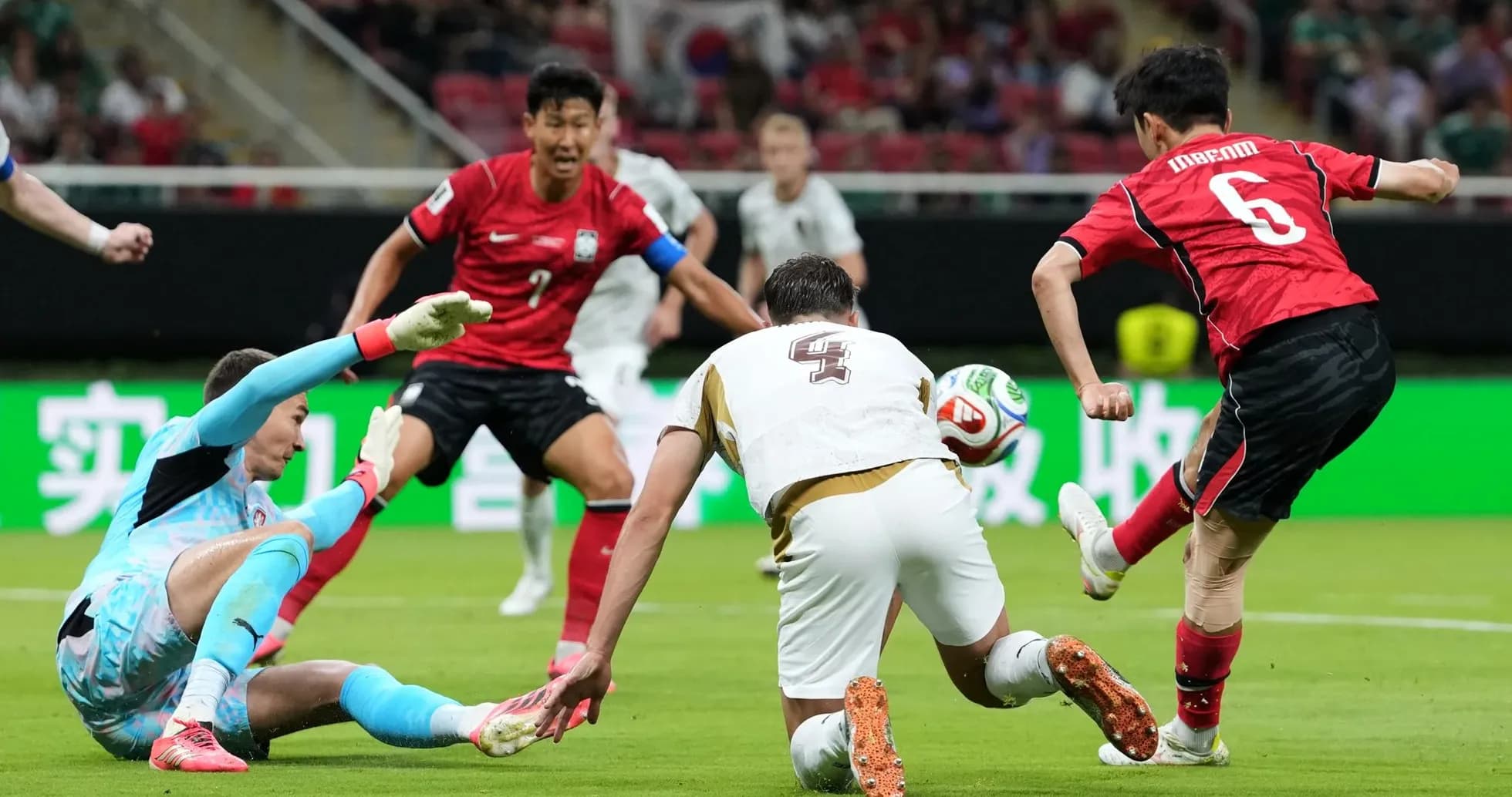 South Korean player attempts to score against Czech goalkeeper South Korean player attempts to score against Czech goalkeeper