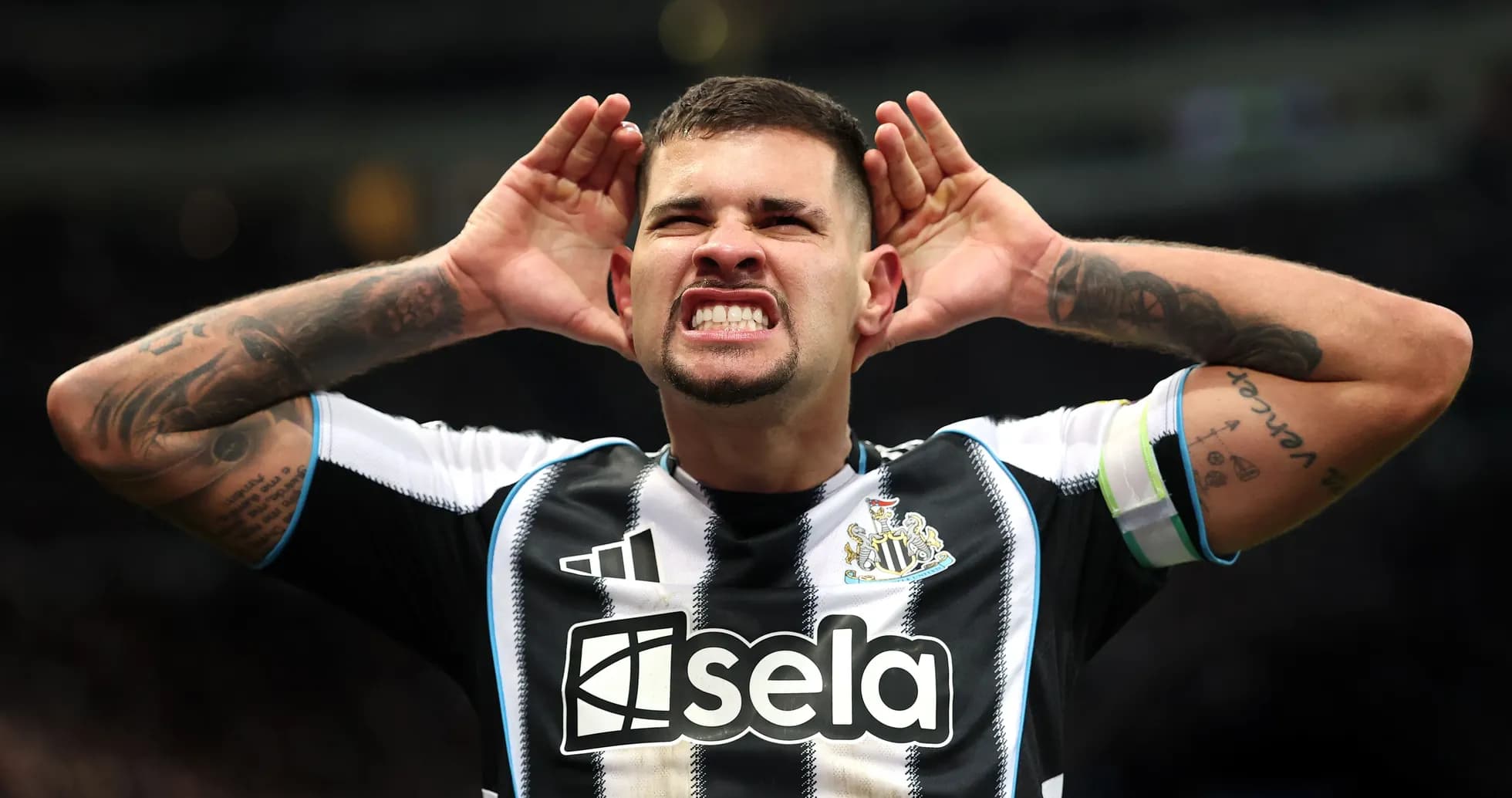 Player celebrating with hands to ears after goal Player celebrating with hands to ears after goal