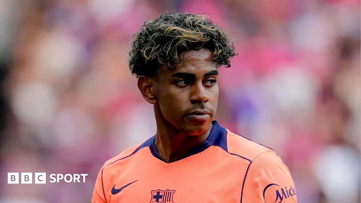 Barcelona player in orange kit during match Barcelona player in orange kit during match