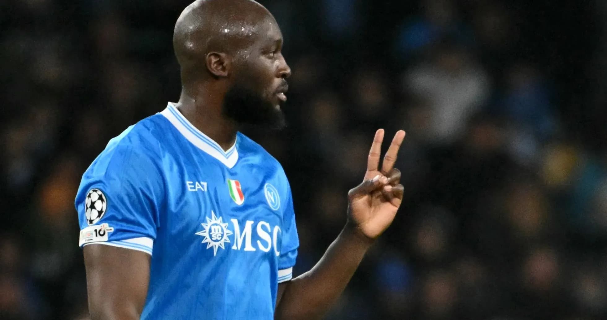 Player celebrating with a peace sign on field Player celebrating with a peace sign on field