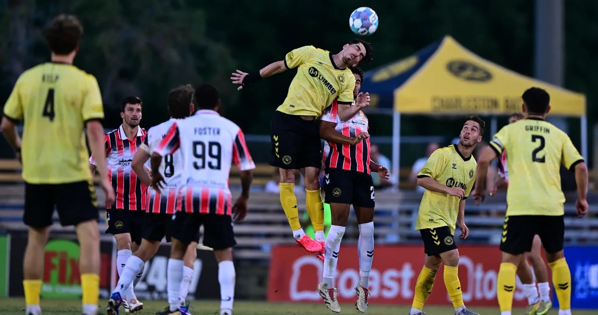 Player jumping for header during Charleston Battery match Player jumping for header during Charleston Battery match