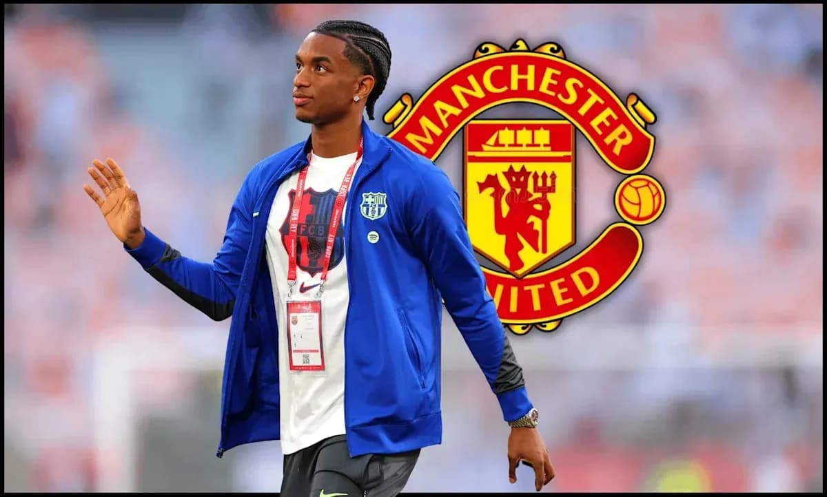 Player walking in front of Manchester United logo Player walking in front of Manchester United logo