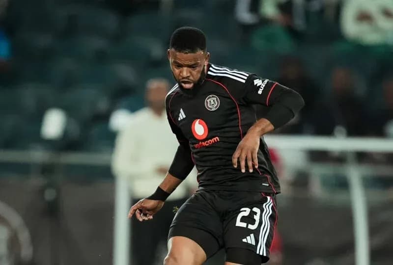 Player in black kit dribbling during match Player in black kit dribbling during match