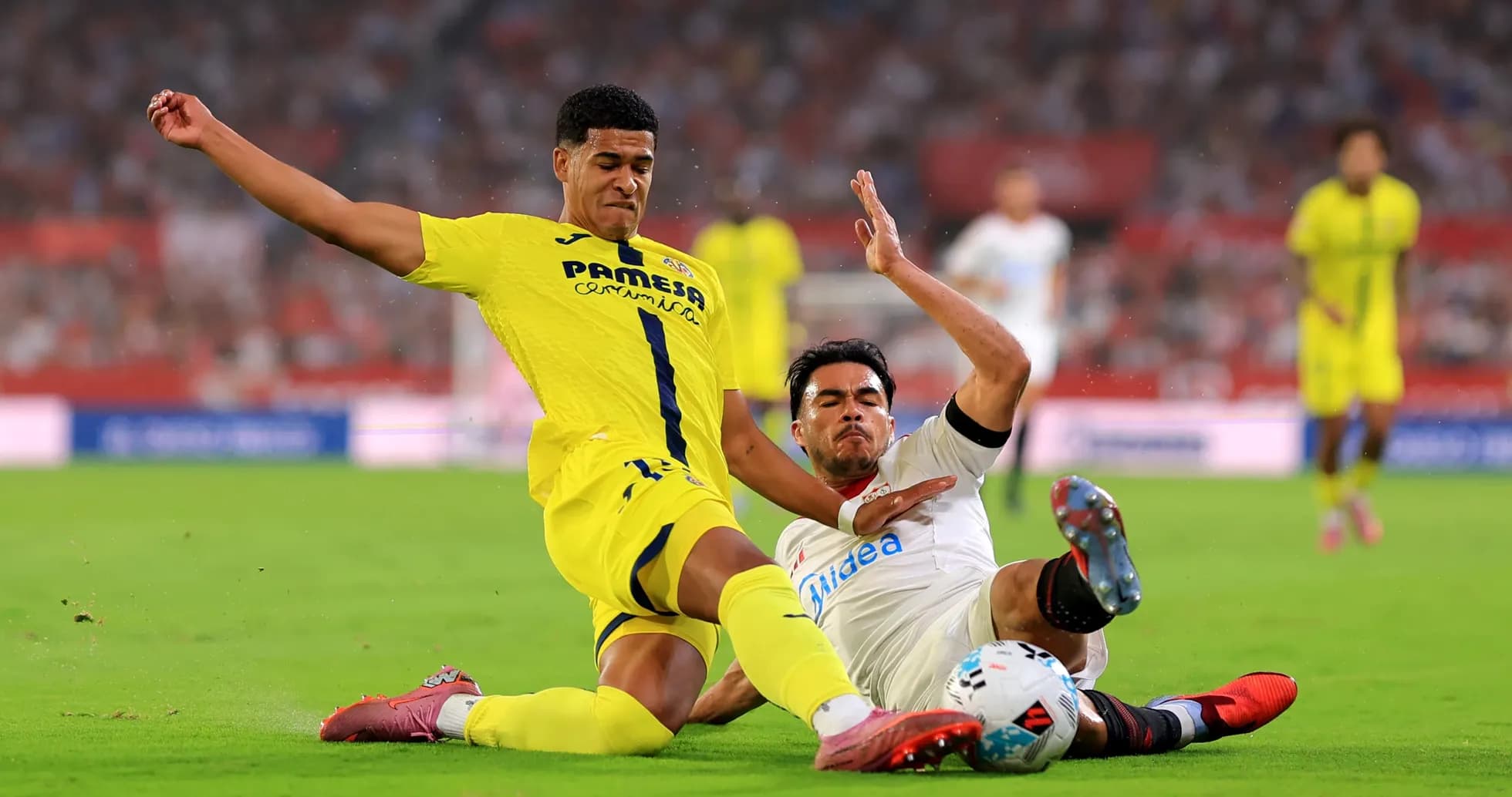Two players challenging for the ball during match Two players challenging for the ball during match