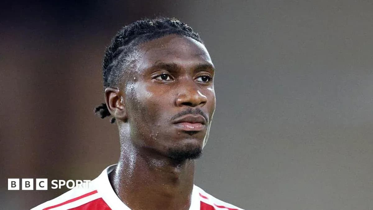 Player in red and white kit during match Player in red and white kit during match