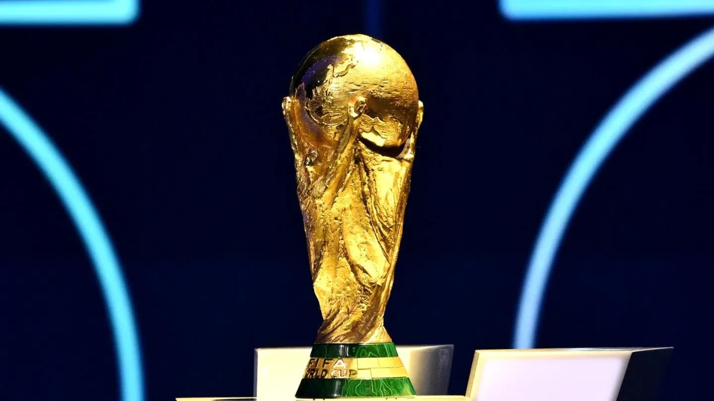 FIFA World Cup trophy displayed on a podium FIFA World Cup trophy displayed on a podium