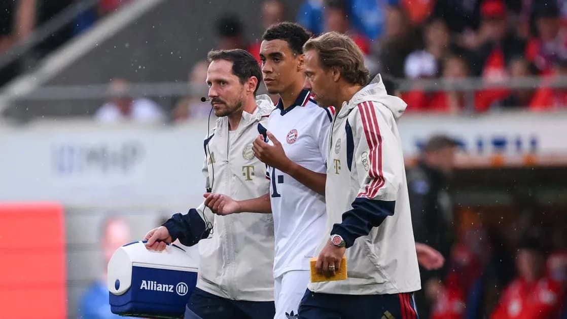 Player being assisted off the field by staff Player being assisted off the field by staff